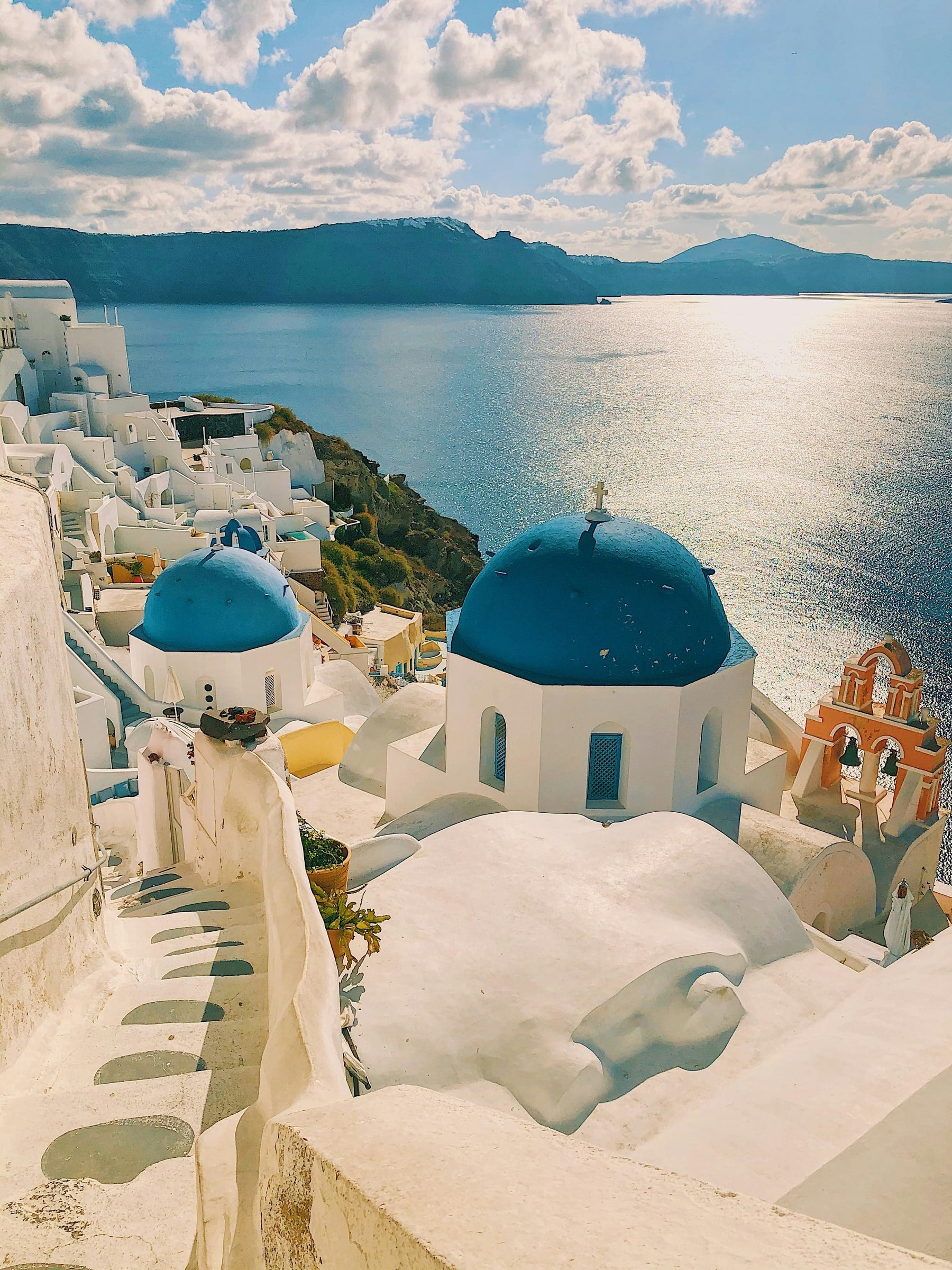 Blue-domed churches above the sea